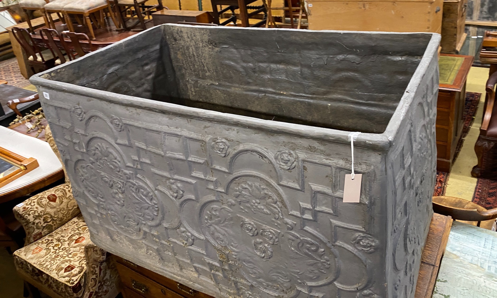 A fibre glass faux lead cistern, length 125cm, depth 72cm, height 75cm